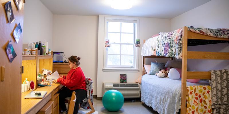 Student studies in her room on campus at Bryn Athyn College